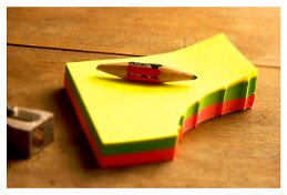 pencil with a Post-it pad null